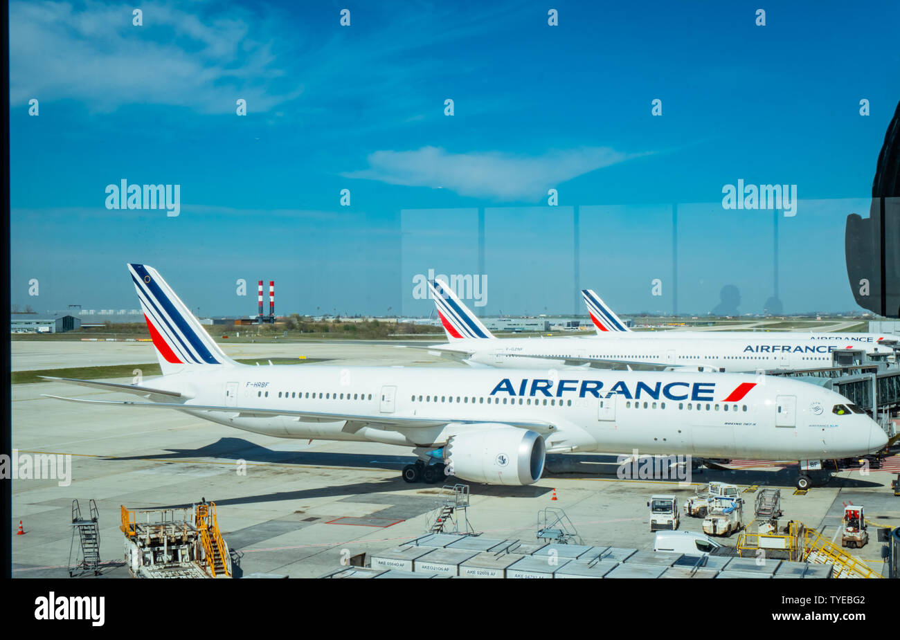 PARIS, FRANCE-MARCH 30, 2019 : Aircraft of Airfrance airline docking at Paris Charles de Gaulle airport. Air France airplane with blue sky and white Stock Photo
