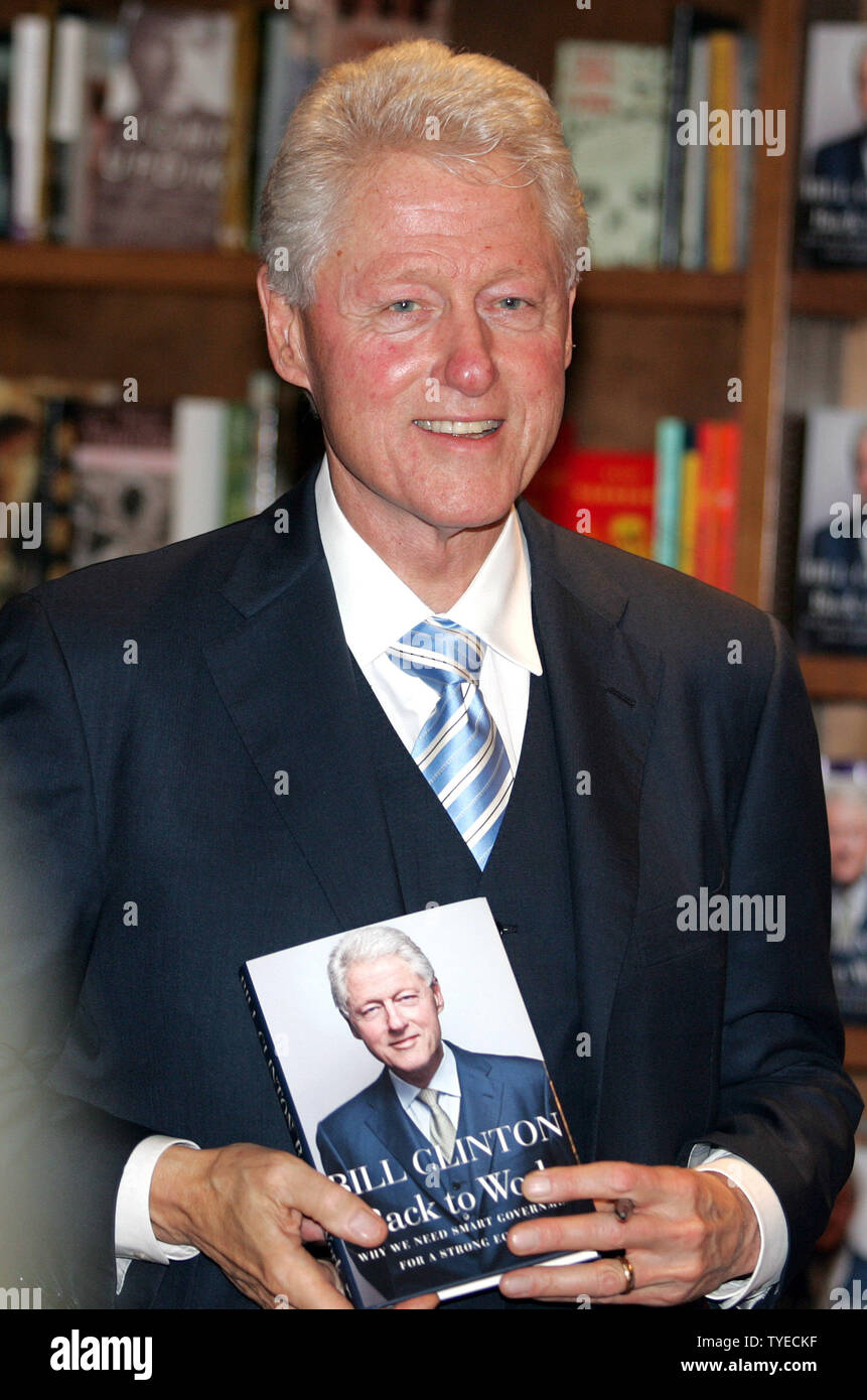 Former US President Bill Clinton signs copies of his new book "Back to Work" at Books and Books in Coral Gables Florida on December 1, 2011. UPI/Michael Bush Stock Photo