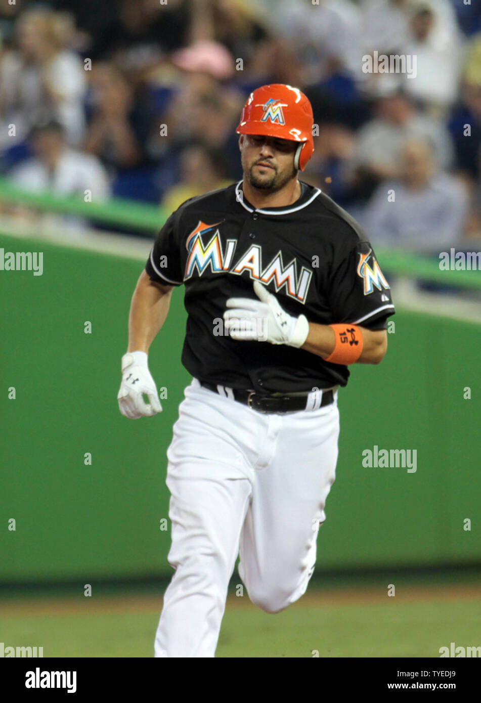 The Miami Marlins Gaby Sanchez runs to third base against the New York  Yankees at the new Miami Marlins Ball Park in the second exhibition game  April 2, 2012, in Miami, Florida. .