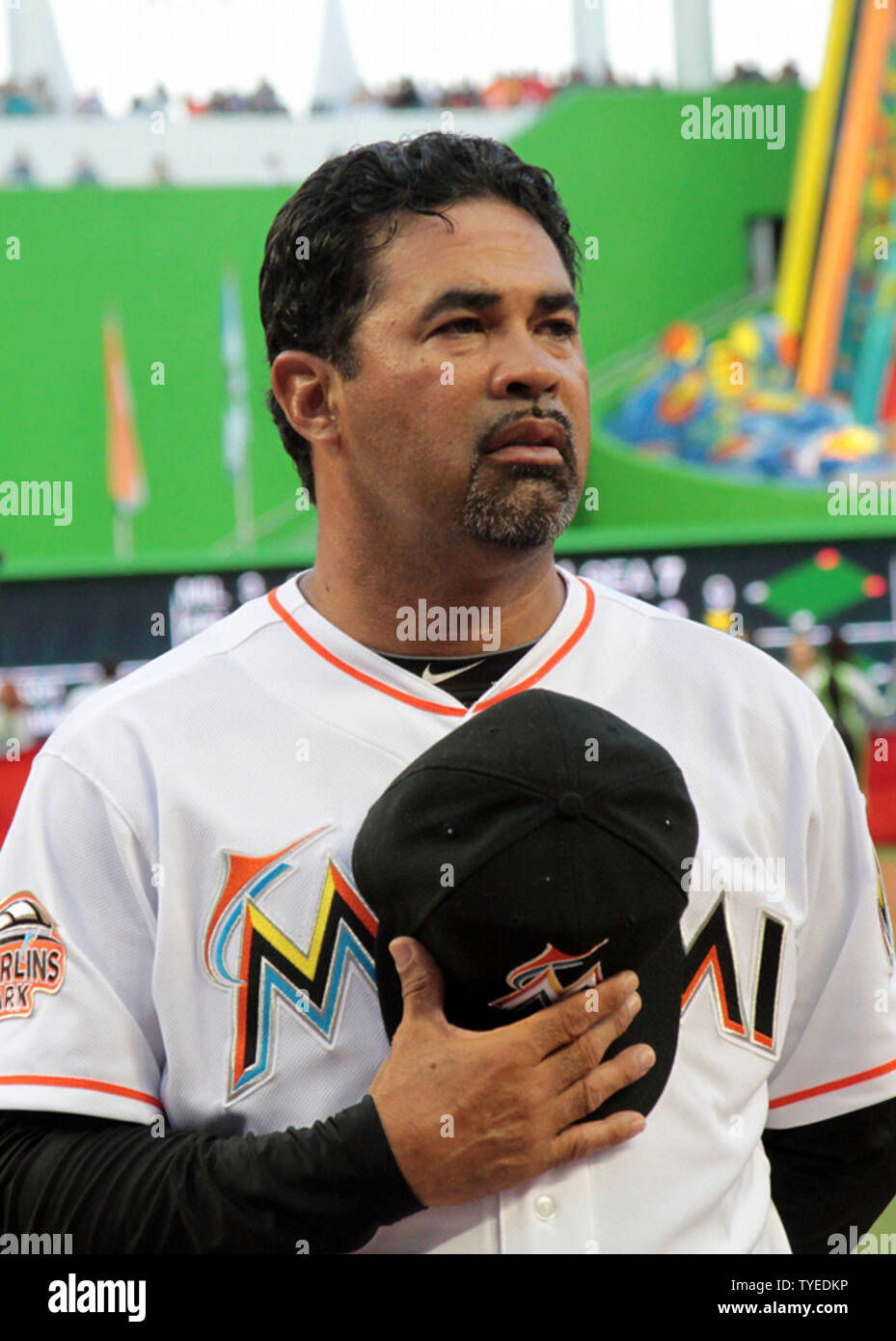 Miami Marlins manager Ozzie Guillen listens to the National Anthem at the  new Miami Marlins Ball Park on opening day April 4, 2012, in Miami, Florida.  The St. Louis Cardinals beat the