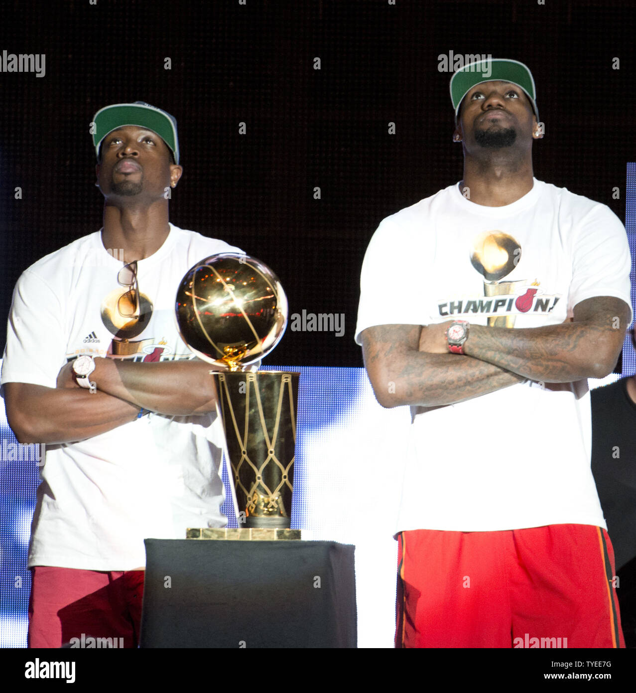 Lebron James (Right) and Dwyne Wade watch the replay of the last game during the celebration for the NBA 2012 Champions Miami Heat inside the American Airlines Arena Miami, Florida, June 25,