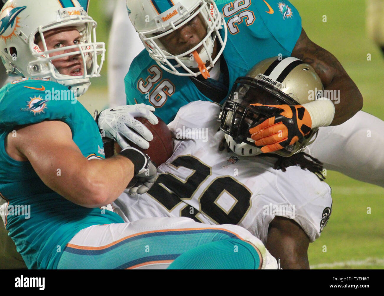 New Orleans Saints running back Khiry Robinson (29) is tackled during the first half against the New Orleans Saints at Sun Life Stadium in Miami, Florida on August 29, 2013.          UPI/Susan Knowles Stock Photo