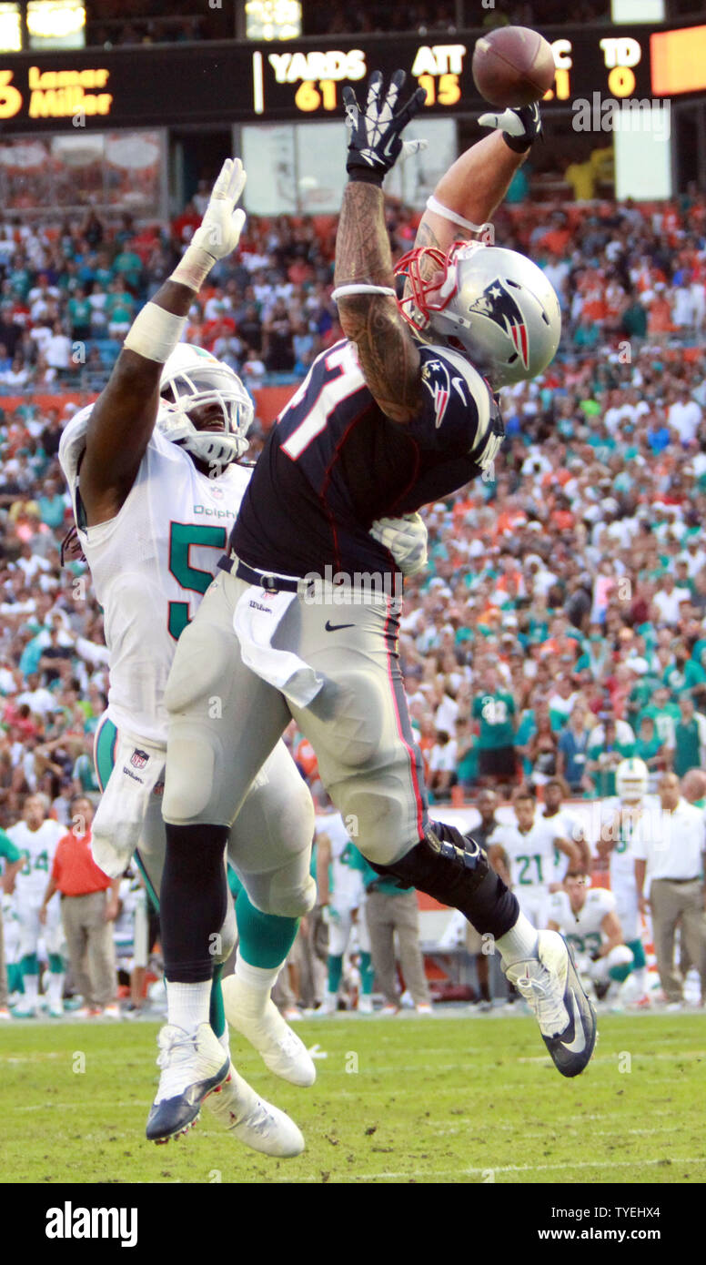 Miami Dolphins LB Dannell Ellerbe (59) breaks up a Brady pass intended for FB James Devlin (47) against the New England Patriots during the final seconds at Sun Life Stadium in Miami, Florida on December 15, 2013. The Dolphins defeated the Patriots  24-20.               UPI/Susan Knowles Stock Photo