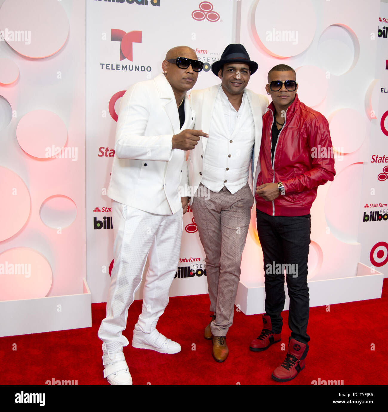 Latin performers Descemer Buero (C) and Gente De Zona appear backstage ...