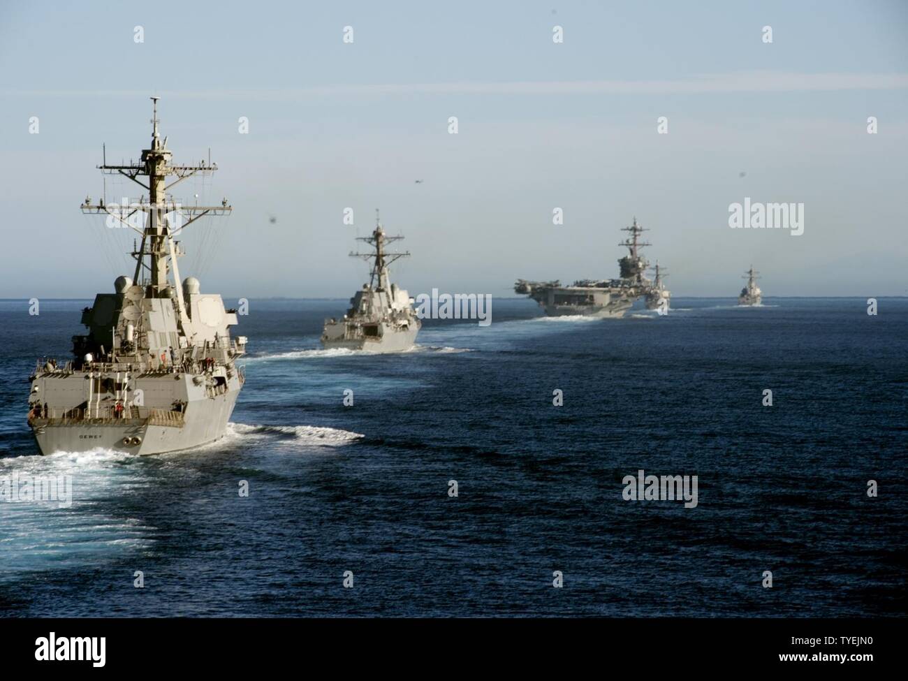 PACIFIC OCEAN (Nov. 4, 2016) Left to right, USS Dewey (DDG 105), USS Wayne E. Meyer (DDG 108), USS Carl Vinson (CVN 70), USS O’Kane (DDG 77) and USS Sterett (DDG 104) participate in a show of force transit training exercise. Carrier Strike Group One is underway conducting Composite Training Unit Exercise in preparation for a future deployment. Stock Photo
