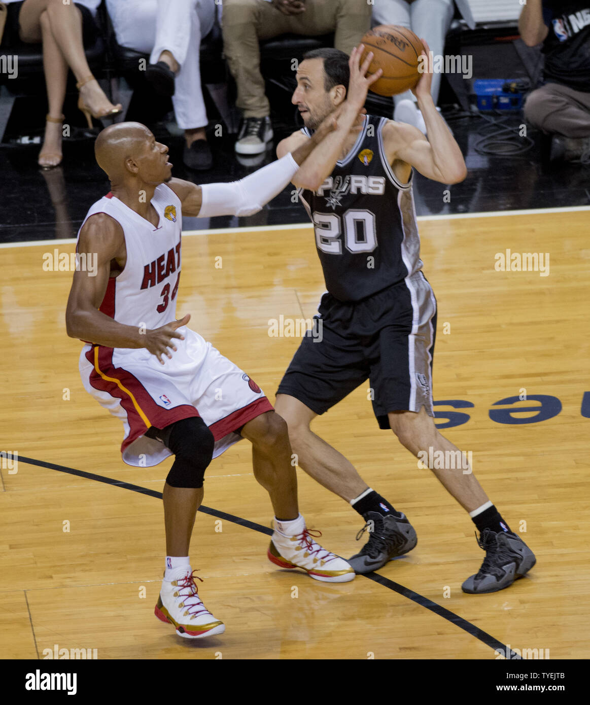 San Antonio Spurs Manu Ginobili (20) moves the ball against Miami Heat Ray Allen (34) in game 3 of the NBA Finals at the American Airlines Arena in Miami on June 10, 2014. The Spurs defeated the Heat 111-92 to take a 2 -1 game  lead in the best of seven series.    UPI/Gary I Rothstein Stock Photo