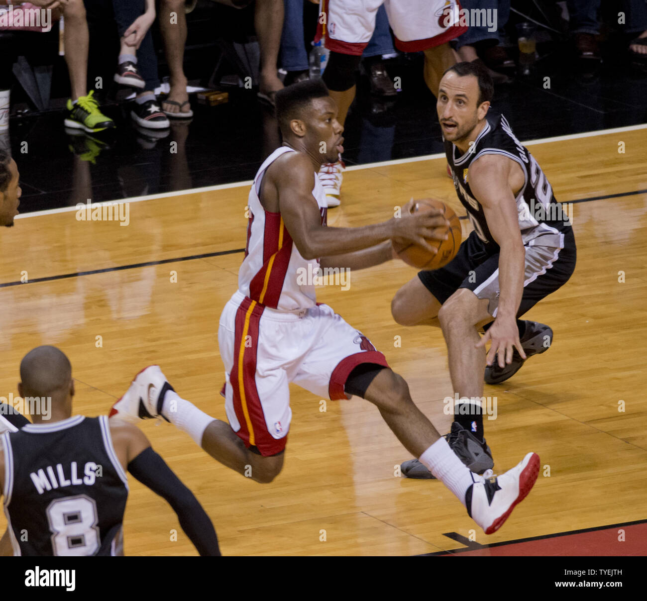 San Antonio Spurs Manu Ginobili (20) defends against  Miami Heat  Norris Cole (30) driving to the basket in game 3 of the NBA Finals at the American Airlines Arena, in Miami, June 10, 2014. The Spurs defeated the Heat 111-92 to take a 2 -1 game  lead in the best of seven series.    UPI/Gary I Rothstein Stock Photo