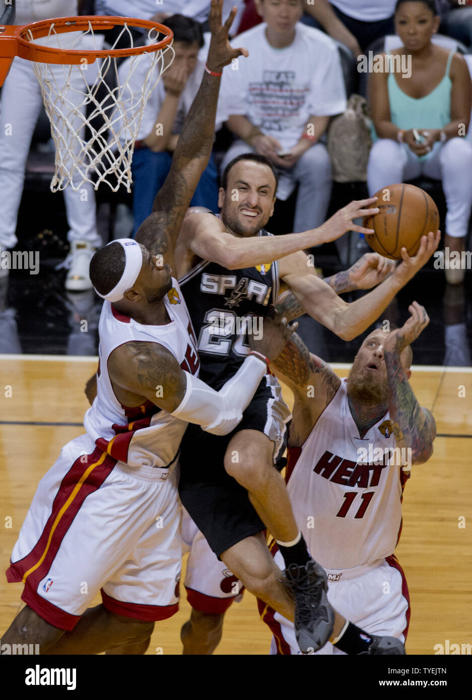 San Antonio Spurs  Manu Ginobili (20) goes up for the basket being guarded by Miami Heat  LeBron James (6) in game 3 of the NBA Finals at the American Airlines Arena, in Miami, June 10, 2014. The Spurs defeated the Heat 111-92 to take a 2 -1 game  lead in the best of seven series.    UPI/Gary I Rothstein Stock Photo