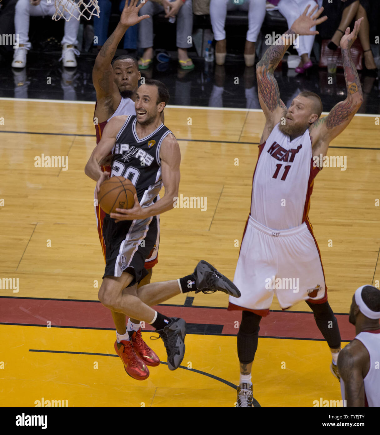 San Antonio Spurs  Manu Ginobili (20) goes up for the basket being guarded by Miami Heat  Chris Andersen (11)in game 3 of the NBA Finals at the American Airlines Arena, in Miami, June 10, 2014. The Spurs defeated the Heat 111-92 to take a 2 -1 game  lead in the best of seven series.    UPI/Gary I Rothstein Stock Photo