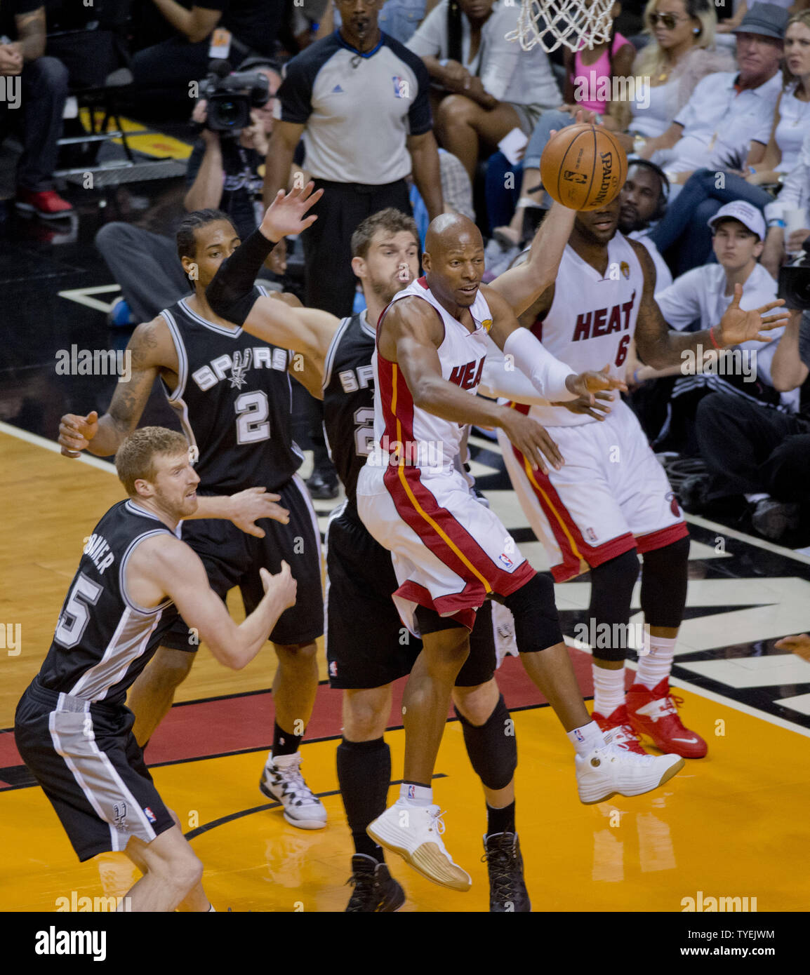 Miami Heat's LeBron James gets control of the ball againstSan Antonio Spurs'  Kawhi Leonard (2) during the first quarter at AmericanAirlines Arena in  Miami, Florida, Tuesday, January 17, 2012. (Photo by Pedro