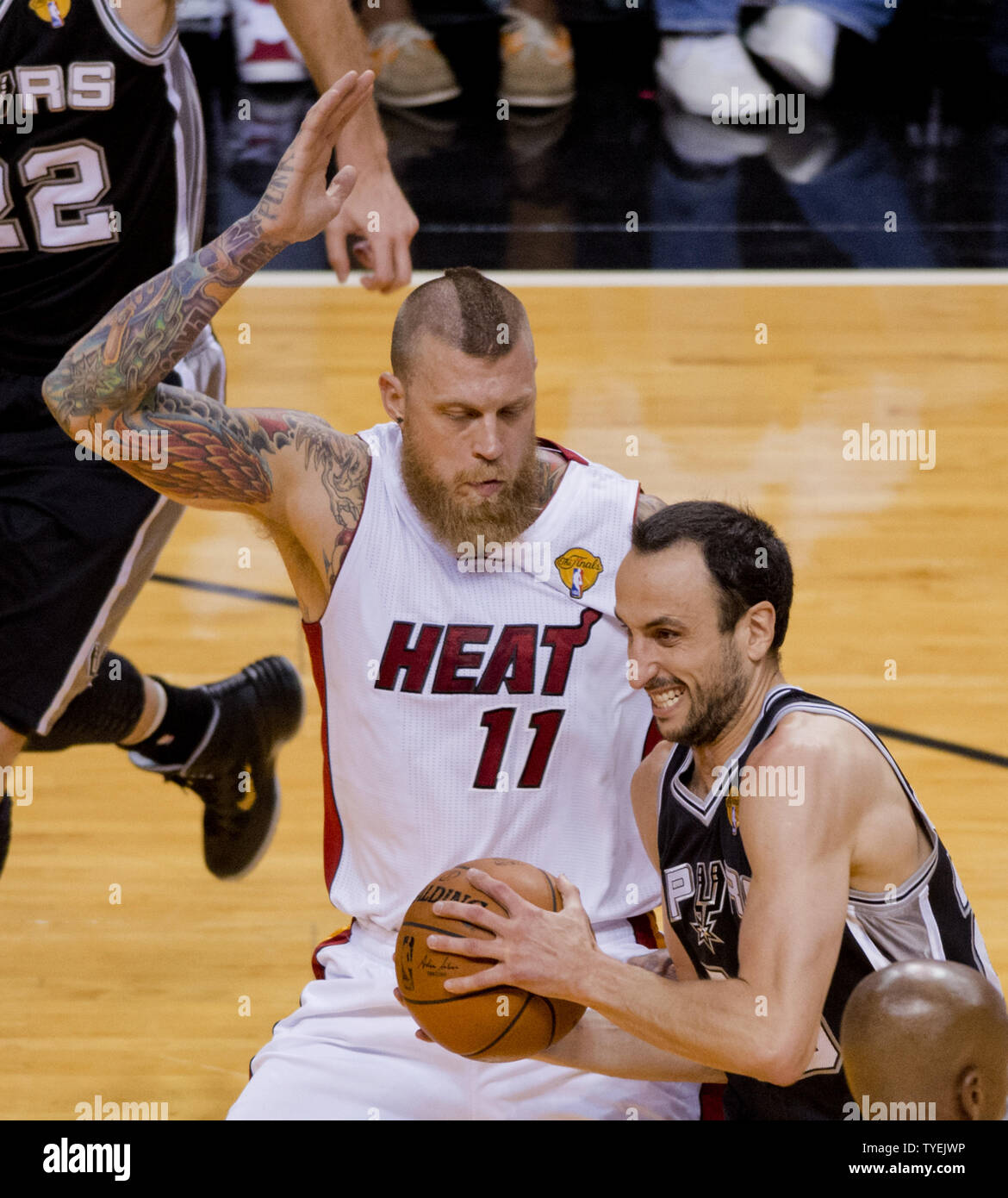 San Antonio Spurs Manu Ginobili (20) drives past  Miami Heat Chris Andersen (11)  in game 4 of the NBA Finals at the American Airlines Arena, in Miami, June 12, 2014. The Spurs defeated the Heat 107-86 to take a 3-1 game lead in the best of seven games. UPI/Gary I Rothstein Stock Photo