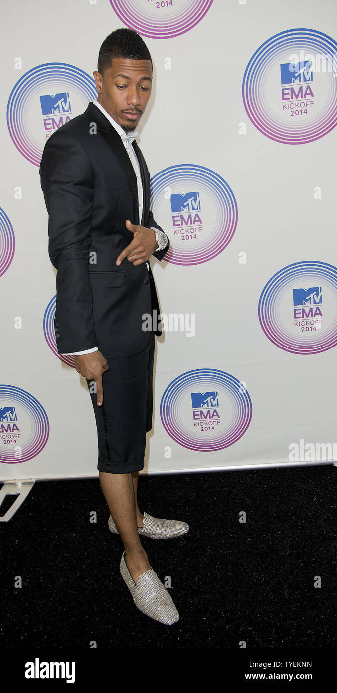 MTV actor, producer and show host Nick Cannon arrive on the red carpet for  the 2014 MTV EMA U.S.Telecast at Klipsch Amphitheater, Miami, Florida on  November 9, 2014. Cannon's shoes are diamond-encrusted,