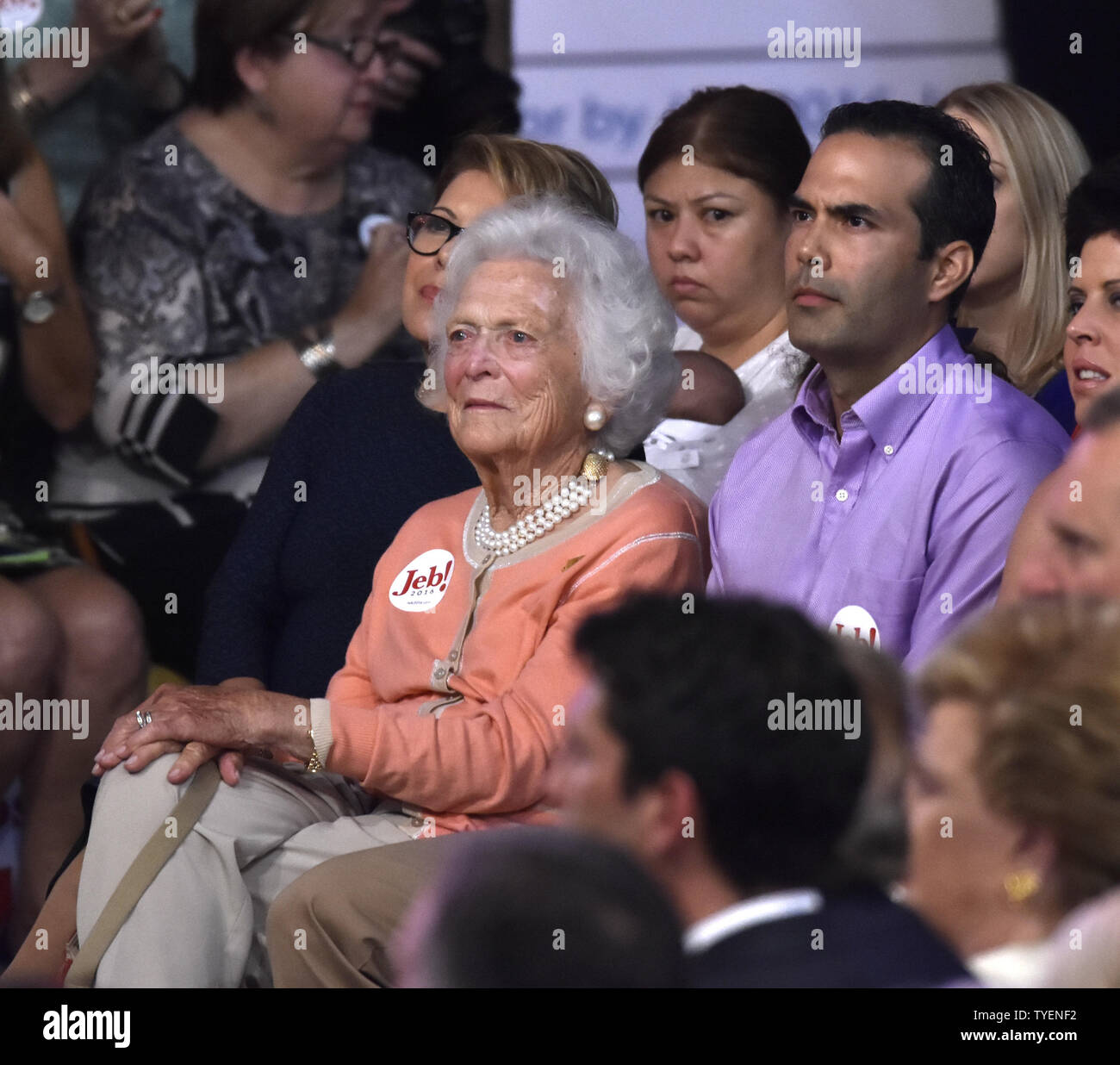 Former First Lady Barbara Bush and former Governor Jeb Bush's son George wait for Jeb Bush to announces his candidacy for the President of The United States during a rally at the Theodore Gibson Health Center of Miami-Dade College, Kendall Campus in Miami, Florida,  June 15, 2015. Photo by Gary I Rothstein/UPI Stock Photo