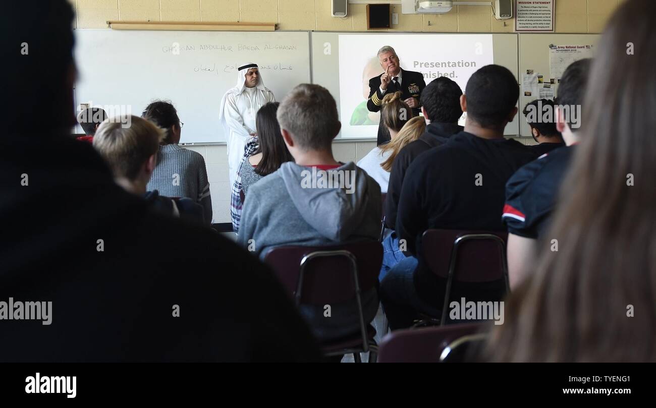 R.I. (Nov. 4, 2016) Staff Cmdr. Ghassan Al-Ghadhban, Iraqi navy, and Capt. Mark Turner, director, U.S. Naval War College (NWC) Naval Staff College, speak with high school students at Rogers High School (RHS) in Newport, Rhode Island about the country of Iraq. Al-Ghadhban is a current NWC student and volunteered to speak to the class as part of RHS’s International Studies Program. The international programs at RHS and NWC directly relate to strengthening global maritime partnerships, one of NWC’s core missions. Stock Photo