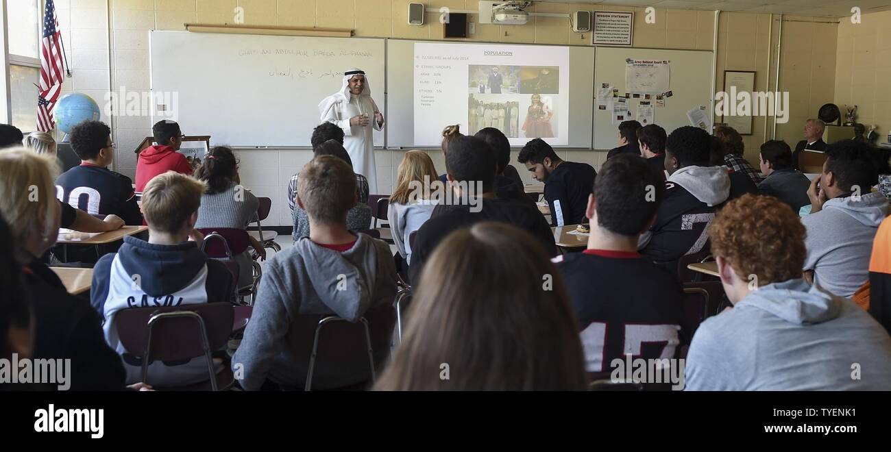 R.I. (Nov. 4, 2016) Staff Cmdr. Ghassan Al-Ghadhban, Iraqi navy, gives a presentation about the country of Iraq to high school students at Rogers High School (RHS) in Newport, Rhode Island. Al-Ghadhban is a current student at U.S. Naval War College (NWC). He volunteered to speak to the class as part of RHS’s International Studies Program. The international programs at RHS and NWC directly relate to strengthening global maritime partnerships, one of NWC’s core missions. Stock Photo