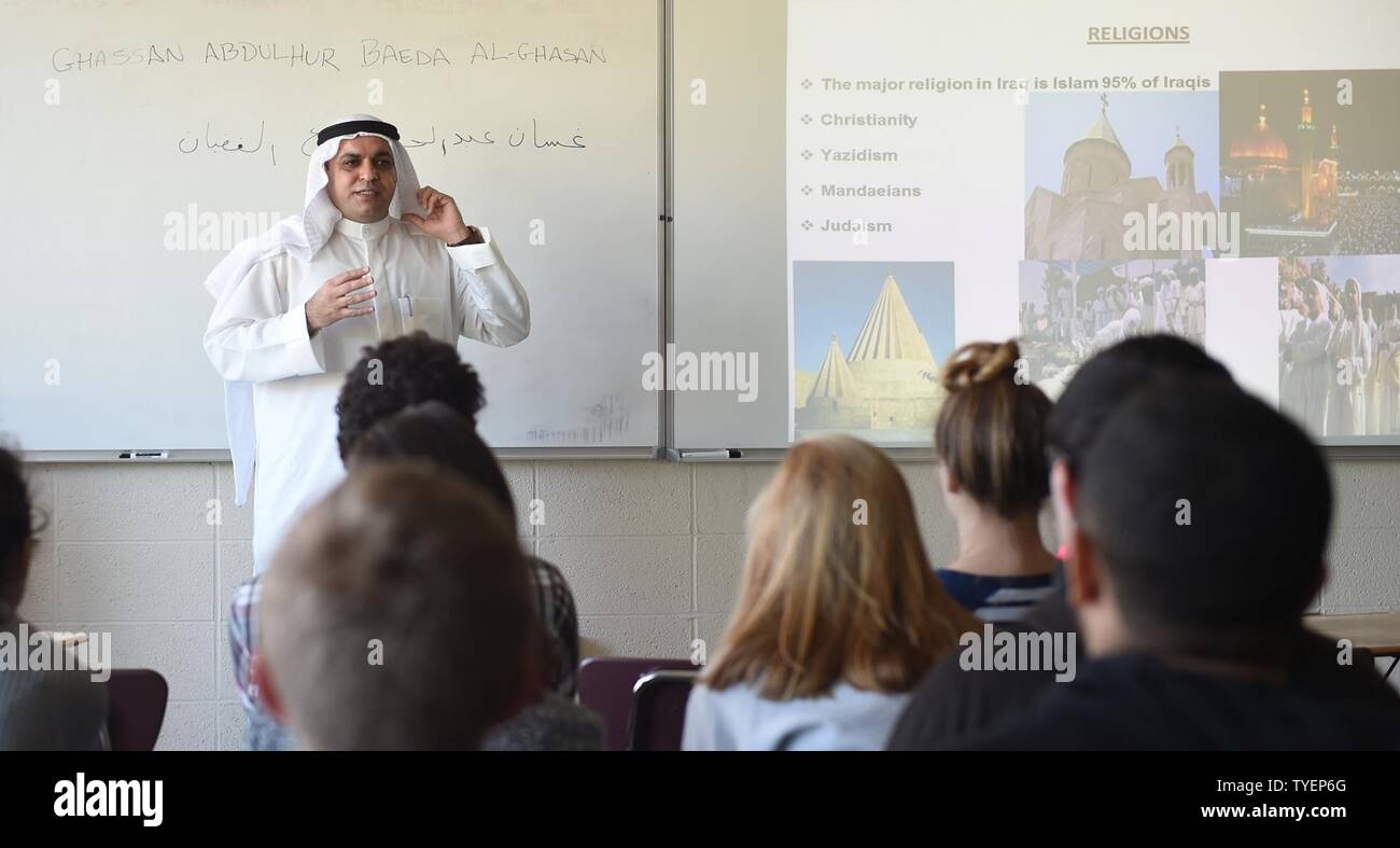 R.I. (Nov. 4, 2016) Staff Cmdr. Ghassan Al-Ghadhban, Iraqi navy, gives a presentation about the country of Iraq to high school students at Rogers High School (RHS) in Newport, Rhode Island. Al-Ghadhban is a current student at U.S. Naval War College (NWC). He volunteered to speak to the class as part of RHS’s International Studies Program. The international programs at RHS and NWC directly relate to strengthening global maritime partnerships, one of NWC’s core missions. Stock Photo