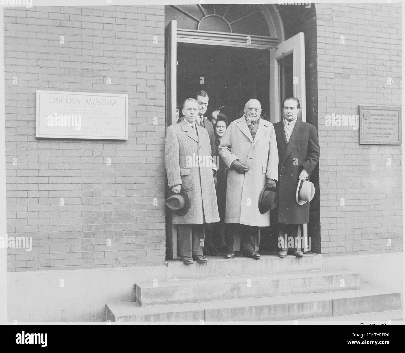 Photograph of a group of unidentified dignitaries in the doorway of the Lincon Museum at Ford's Theater in Washington, the site of President Lincoln's assassination. Stock Photo