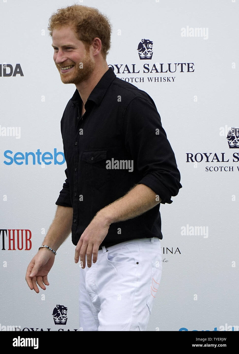 Britain's Prince Harry arrives at the 2016 Sentebale Royal Salute Polo ...
