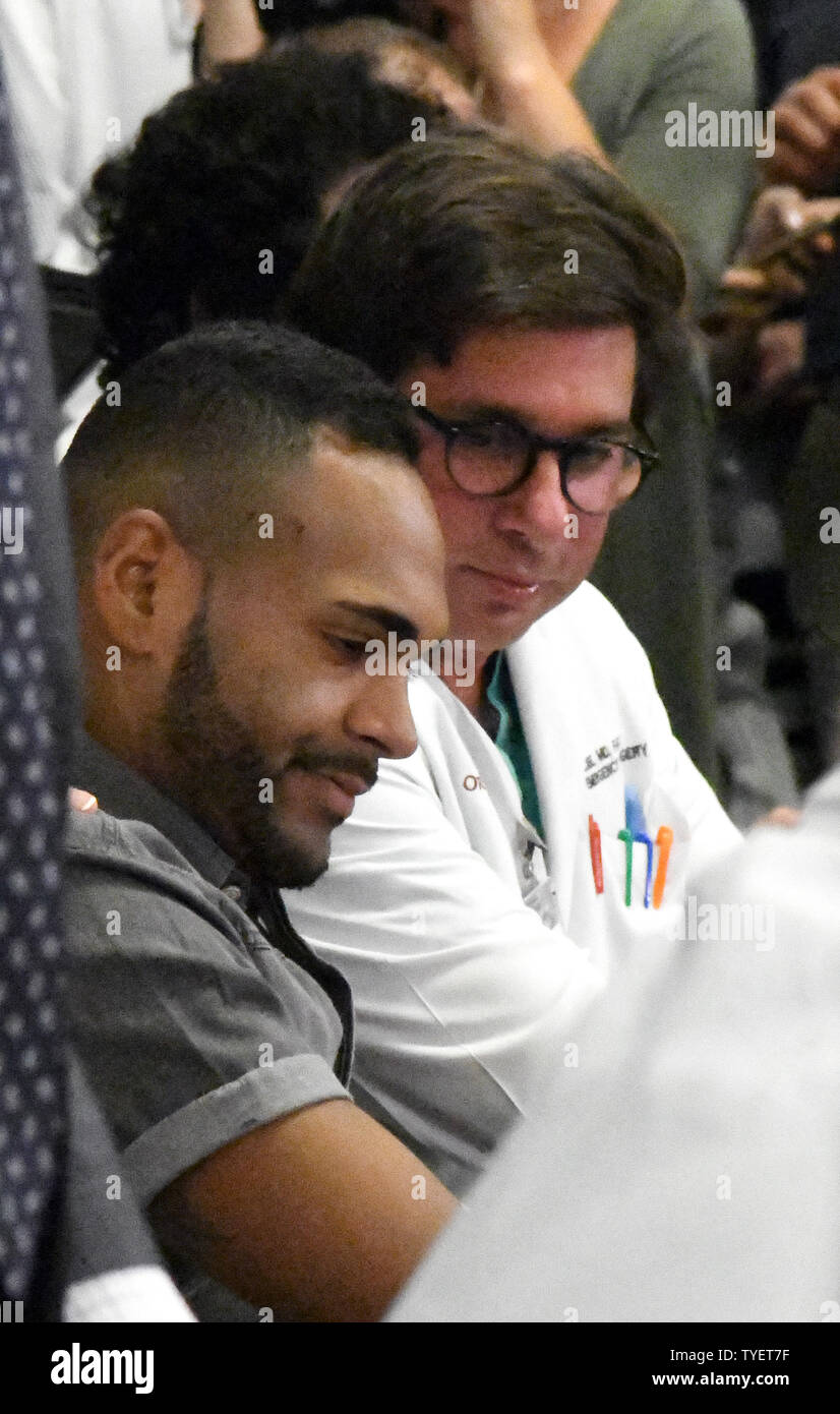 Angel Colon, (L) one of the 53 survivors from the PULSE nightclub ...