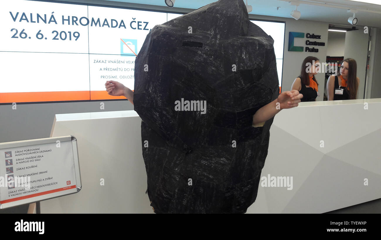 Greenpeace activist in coal costume as a minority shareholder tries to enter annual general meeting of the CEZ Group, on June 26, 2019, in Prague, Czech Republic. (CTK Photo/Tomas Cizek) Stock Photo