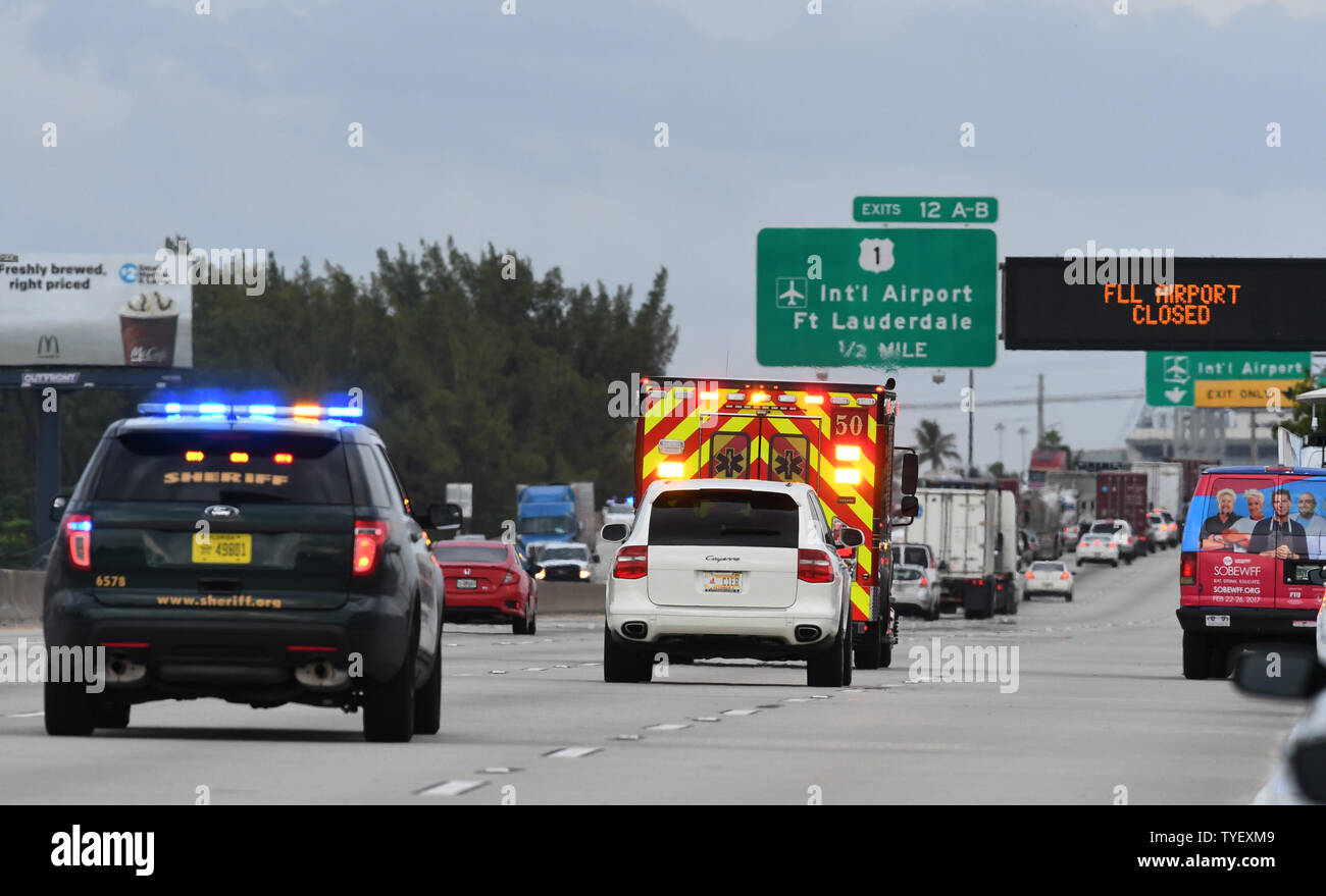 Emergency vehicles head to Fort Lauderdale airport where a gunman