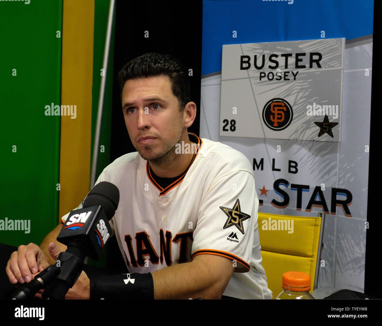 San Francisco Giants catcher Buster Posey sits on the field during media   Q&A before the start of the 2017 MLB home run derby at Marlins Park in Miami, Florida on July 10, 2017. Photo by Gary I  Rothstein/UPI Stock Photo