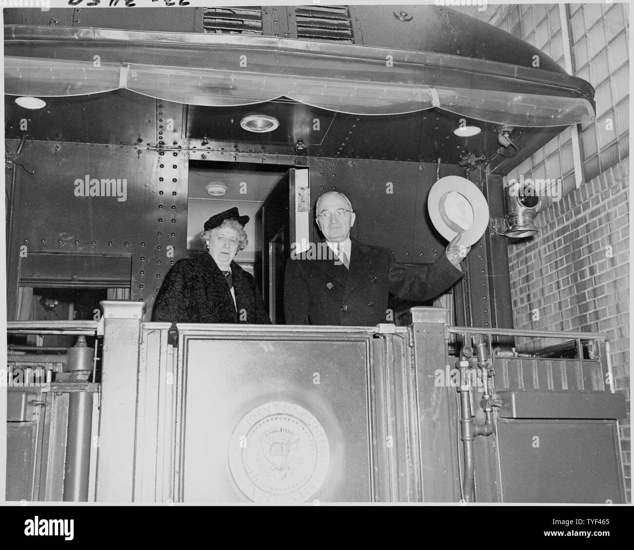 Photograph of the President and Mrs. Truman on the rear platform of the