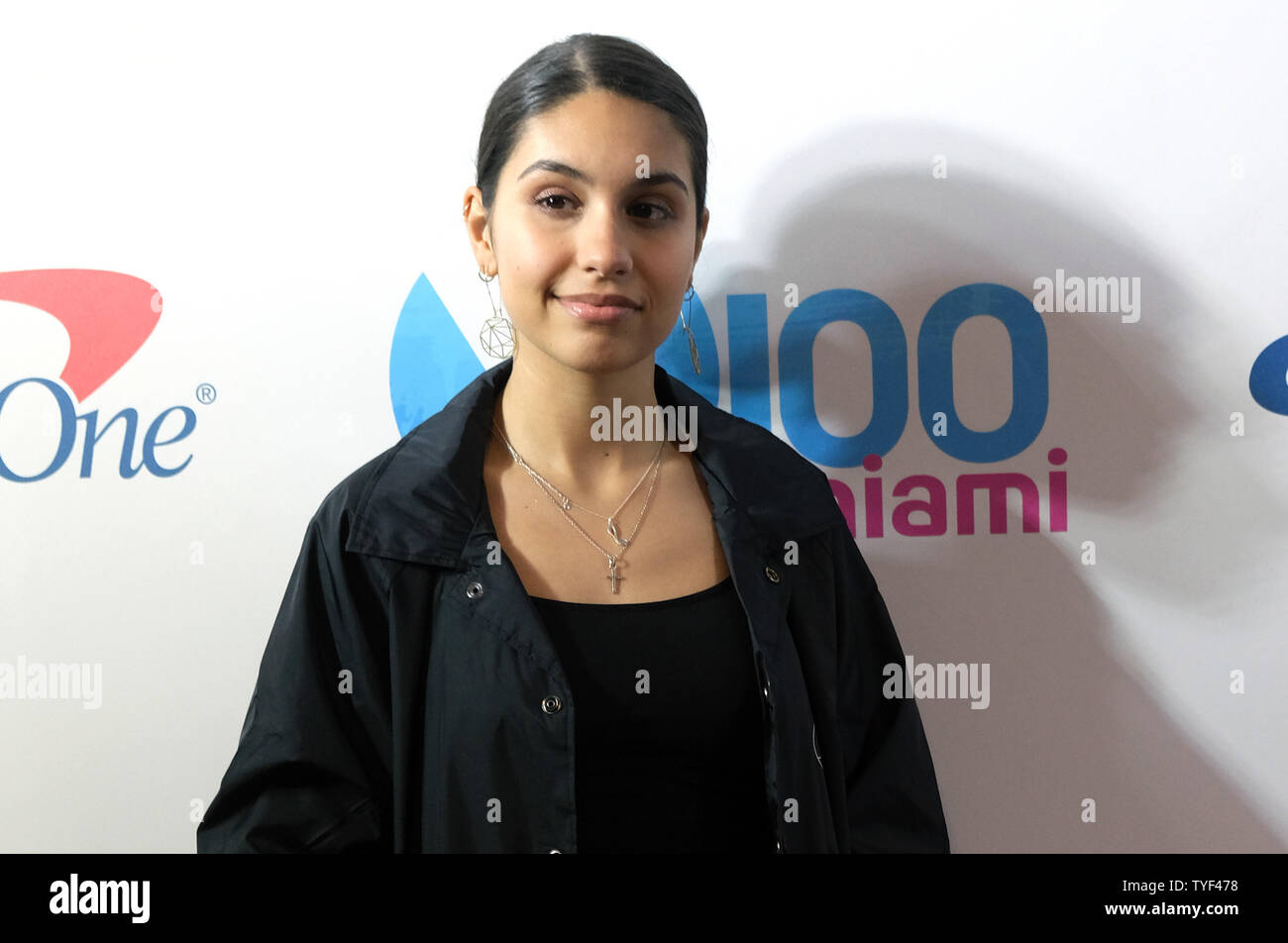 Alessia Cara walks the red carpet at the Y100 iHeartRadio Jingle Ball