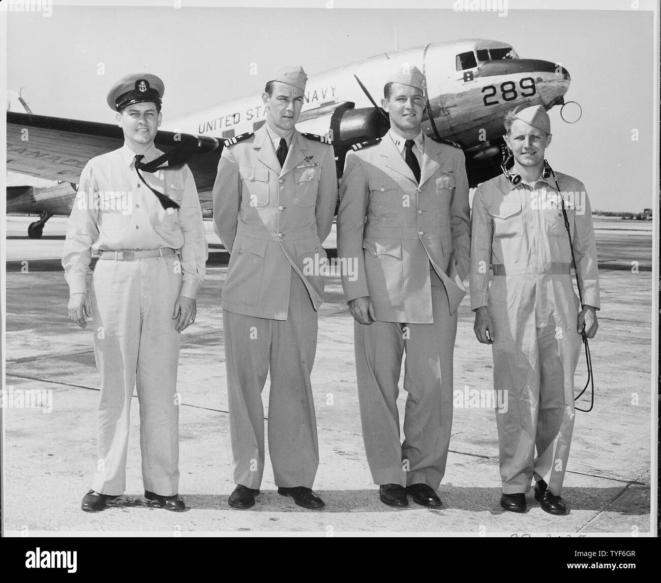 Photograph of the crew of a U.S. Navy R4DZ aircraft which was used by members of President Truman's party during his vacation in Key West: (left to right) Aviation Chief Machinist's Mate Robert Pope; Lt. Commander Fred Card, Jr., the pilot; Lt. Thomas J. Beare, the co-pilot; and Aviation Radioman Charles R. Fross. Stock Photo