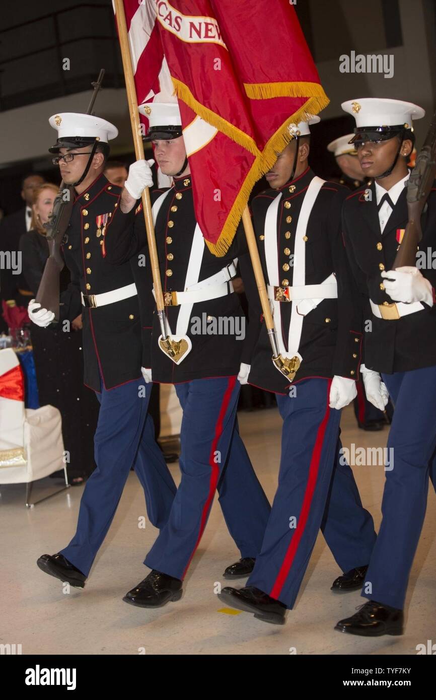 U.S. Marines with Headquarters and Headquarters Squadron (H&HS) color guard march with colors during the Marine Corps Air Station New River 241st  Marine Corps Birthday Ball at the Crystal Coast Civic Center, Morehead City, N.C., Nov. 5, 2016. The Marine Corps has carried 241 years of traditions, values and standards since its establishment in 1775. Stock Photo