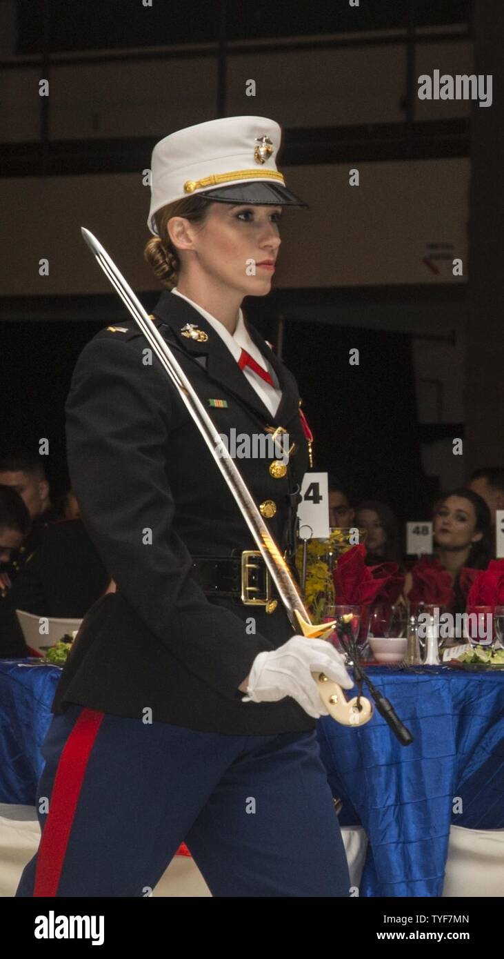 U.S. Marine Corps 1st Lt. Rachel Paul, adjutant, Headquarters and Headquarters Squadron (H&HS), marches forward during the H&HS, Marine Corps Air Station New River 241st Marine Corps Birthday Ball at the Crystal Coast Civic Center, Morehead City, N.C., Nov. 5, 2016. The Marine Corps has carried 241 years of traditions, values and standards since its establishment in 1775. Stock Photo