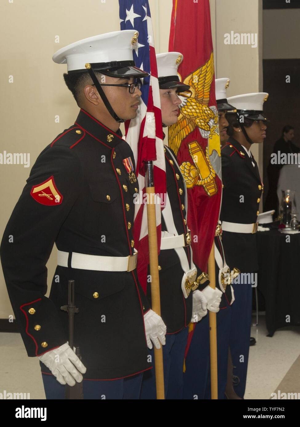 U.S. Marines with the Marine Corps Air Station New River (MCAS) New River color guard stand at attention during the Headquarters and Headquarters Squadron, MCAS New River 241st Marine Corps Birthday Ball at the Crystal Coast Civic Center, Morehead City, N.C., Nov. 5, 2016. The Marine Corps has carried 241 years of traditions, values and standards since its establishment in 1775. Stock Photo