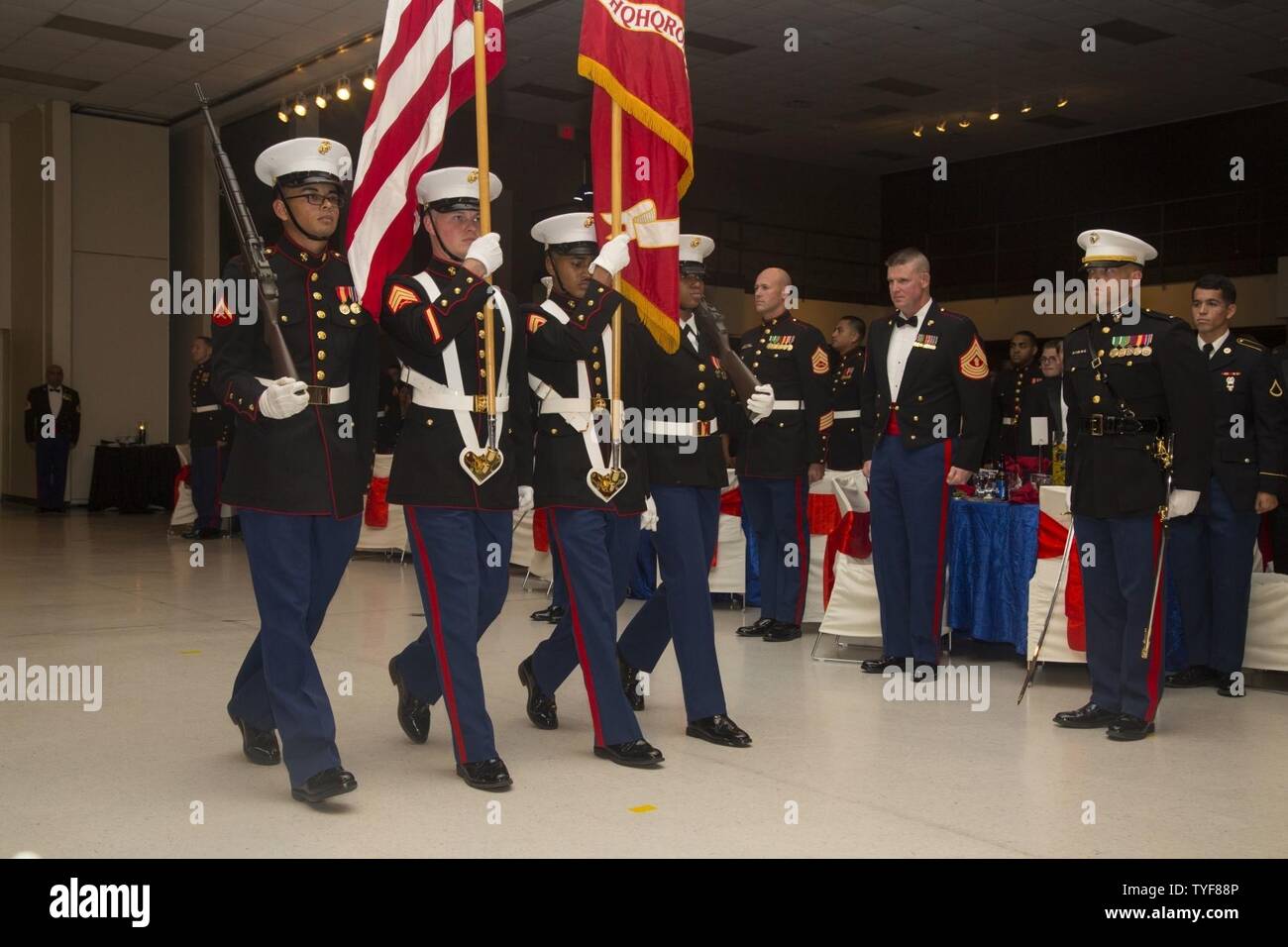 U.S. Marines with the Marine Corps Air Station New River (MCAS New River) color guard march the colors during the Headquarters and Headquarters Squadron MCAS New River 241st Marine Corps Birthday Ball at the Crystal Coast Civic Center, Morehead City, N.C., Nov. 5, 2016. The Marine Corps has carried 241 years of traditions, values and standards since its establishment in 1775. Stock Photo