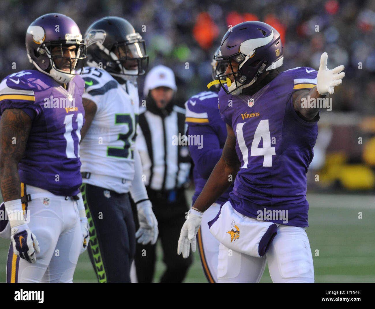 Minnesota Vikings wide receiver Stefon Diggs (14) indicates a first down  after his catch in the first quarter against the Seattle Seahawks in the  AFC Wild Card game at U.S. Bank Stadium