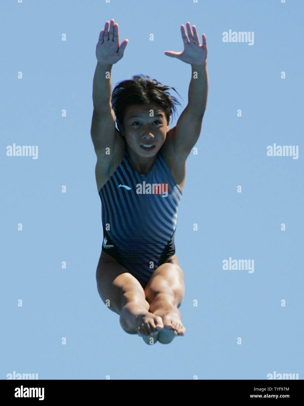 Chinese diver Tong Jia performs her fourth semi-final dive from the 10-meter tower at the XI FINA World Championships in Montreal, Canada on July 20, 2005.  Miss Jia, who already won a gold at these championships in synchronized platform diving, stand in third place behind American Laura Wilkinson and Canadian Emilie Heymans entering the finals. (UPI Photo / Grace Chiu) Stock Photo