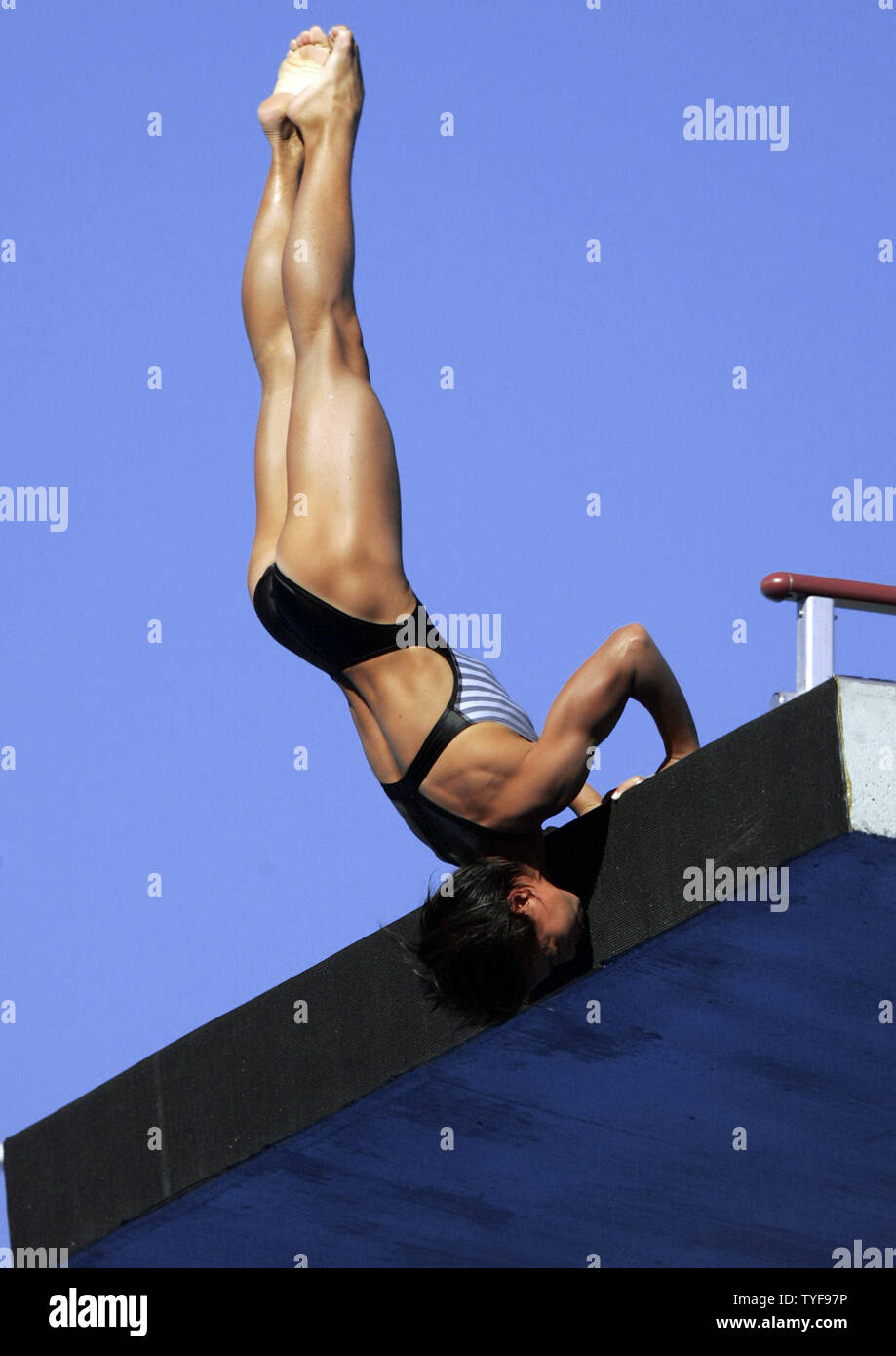 Chinese diver Tong Jia pushes off the 10-meter tower from a handstand in the finals at the XI FINA World Championships in Montreal, Canada on July 20, 2005.  Miss Jia, who earlier won the 10-meter synchronized platform competition, adds a bronze medal with 550.98 points behind American Laura Wilkinson and Loudy Tourky of Australia. (UPI Photo / Grace Chiu) Stock Photo