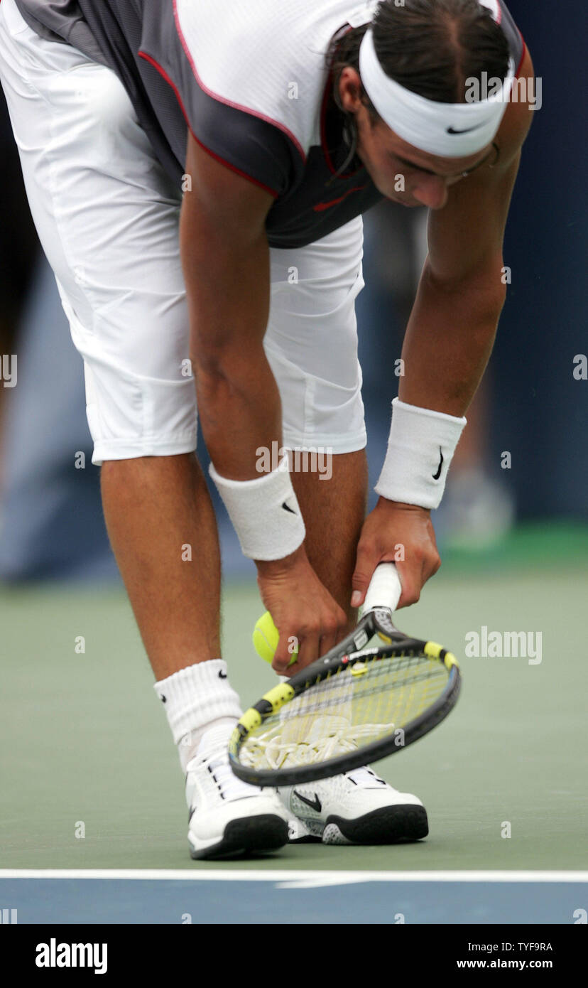 After a changeover, Spains Rafael Nadal customarily checks his socks before serving to Andre Agassi in the final match of the Rogers Cup mens tennis ATP masters tournament in Montreal on August