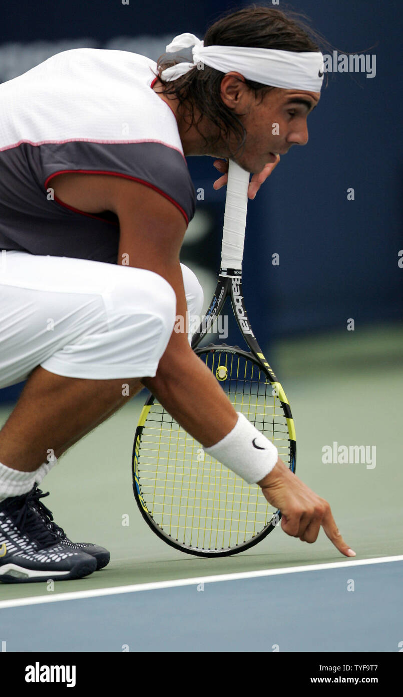 Spains Rafael Nadal disputes a line call from a server by Andre Agassi in second set of the final match of the Rogers Cup mens tennis ATP masters tournament in Montreal on