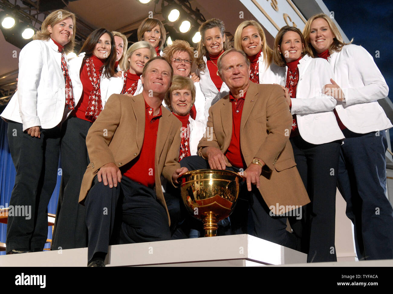 U.S. Team captain Jack Nicklaus (R) and Assistant Team Captain Jeff Sluman joined by the team's wives poses with the The Presidents Cup after the U.S. Team defeated the International Team 19.5 to 14.5 at The Royal Montreal Golf Club in Montreal on September 30, 2007. (UPI Photo/Kevin Dietsch) Stock Photo