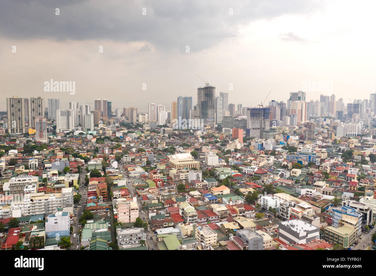 Residential areas and streets of Manila, Philippines, top view. Roofs