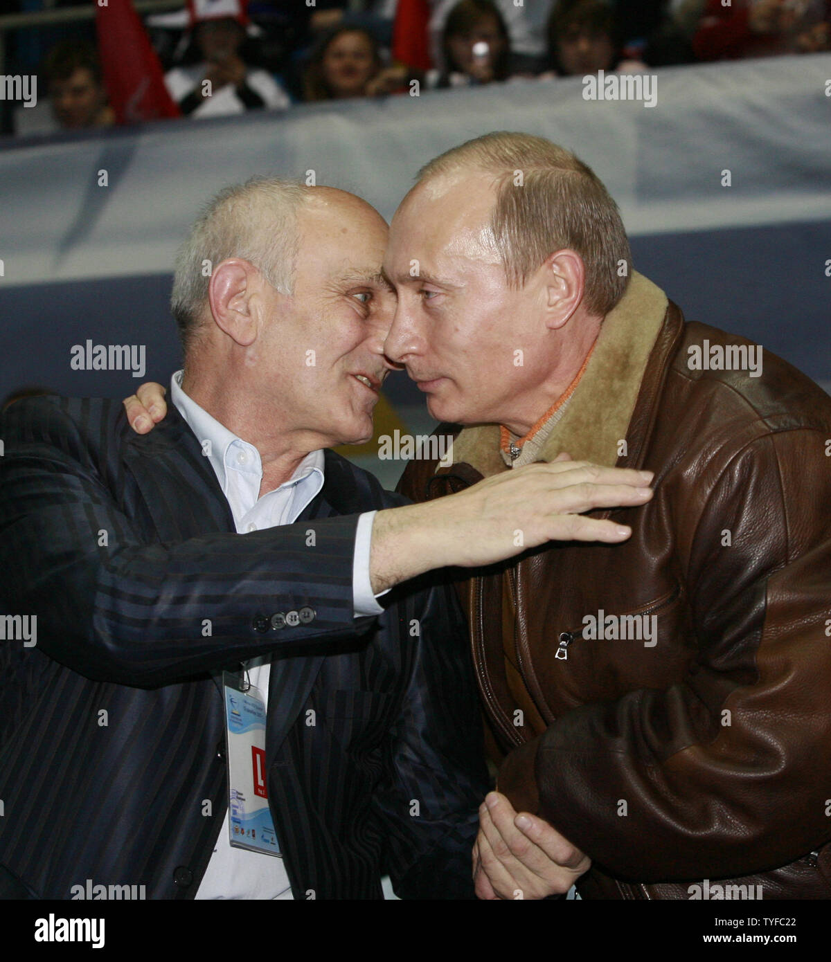 Russian President Vladimir Putin (R) greets his first judo coach Anatoli Rakhlin as he attends a judo competition in Moscow on December 15, 2007. Putin accused the West on Saturday of playing politics with European arms control and warned that the launch of US interceptor missiles could trigger a Russian missile strike. (UPI Photo/Anatoli Zhdanov).. Stock Photo
