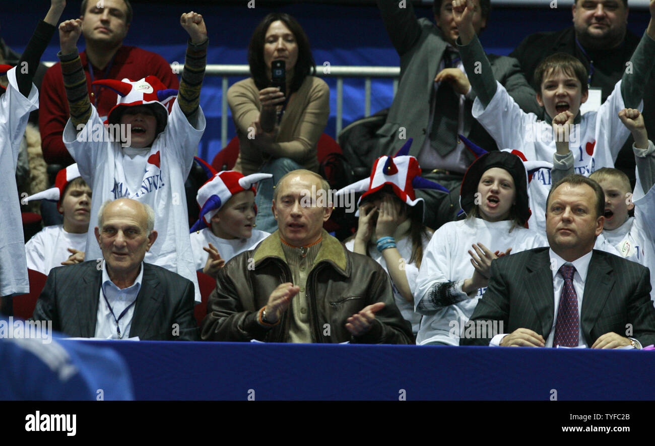 Russian President Vladimir Putin (C) reacts as he attends a judo competition in Moscow on December 15, 2007. Putin accused the West on Saturday of playing politics with European arms control and warned that the launch of US interceptor missiles could trigger a Russian missile strike. (UPI Photo/Anatoli Zhdanov).. Stock Photo