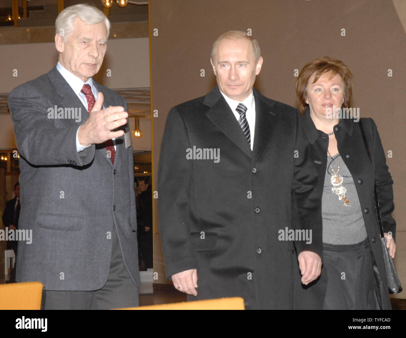 Russian President Vladimir Putin waves as he and his wife Lyudmila arrive to vote in the presidential election at a polling station in Moscow, on March 2, 2008. (UPI Photo/Stringer) Stock Photo
