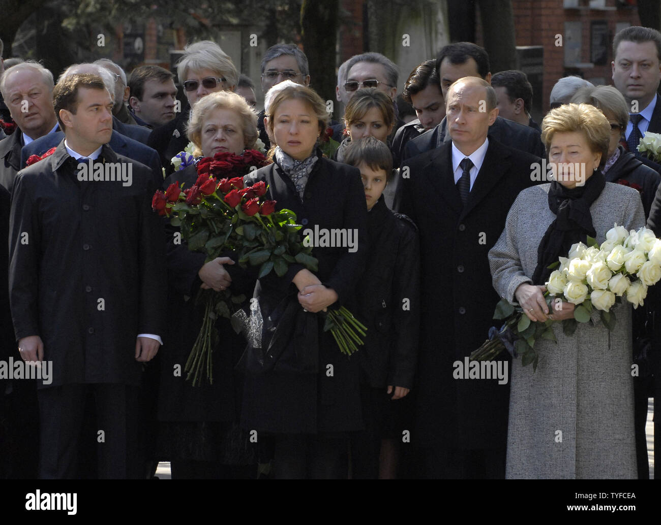 Russian President Vladimir Putin (2nd R) stands with the widow of Russia's first President Boris Yeltsin, Naina (R), as President-elect Dmitry Medvedev (L) looks on, during a ceremony for the unveiling of a monument to commemorating the first anniversary of the death of President Yeltsin at the Novodevichy cemetery in Moscow on April 23, 2008. Putin and hundreds of the country's political elite gathered to pay their respects to Boris Yeltsin on the first anniversary of his death. (UPI Photo/Alexander Astafiev) Stock Photo