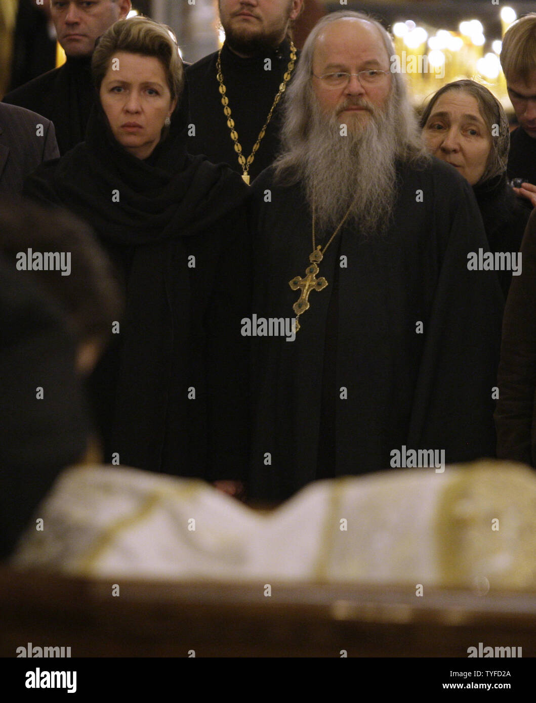 Russian first lady Svetlana Medvedeva (L) mourns at a casket with late Patriarch Alexy II in the Christ the Savior Cathedral in Moscow on December 7, 2008. Patriarch Alexy II who led the Russian Orthodox church since 1990 during a post-Soviet revival of faith, died at the age of 79 on Friday. (UPI Photo/Anatoli Zhdanov) Stock Photo