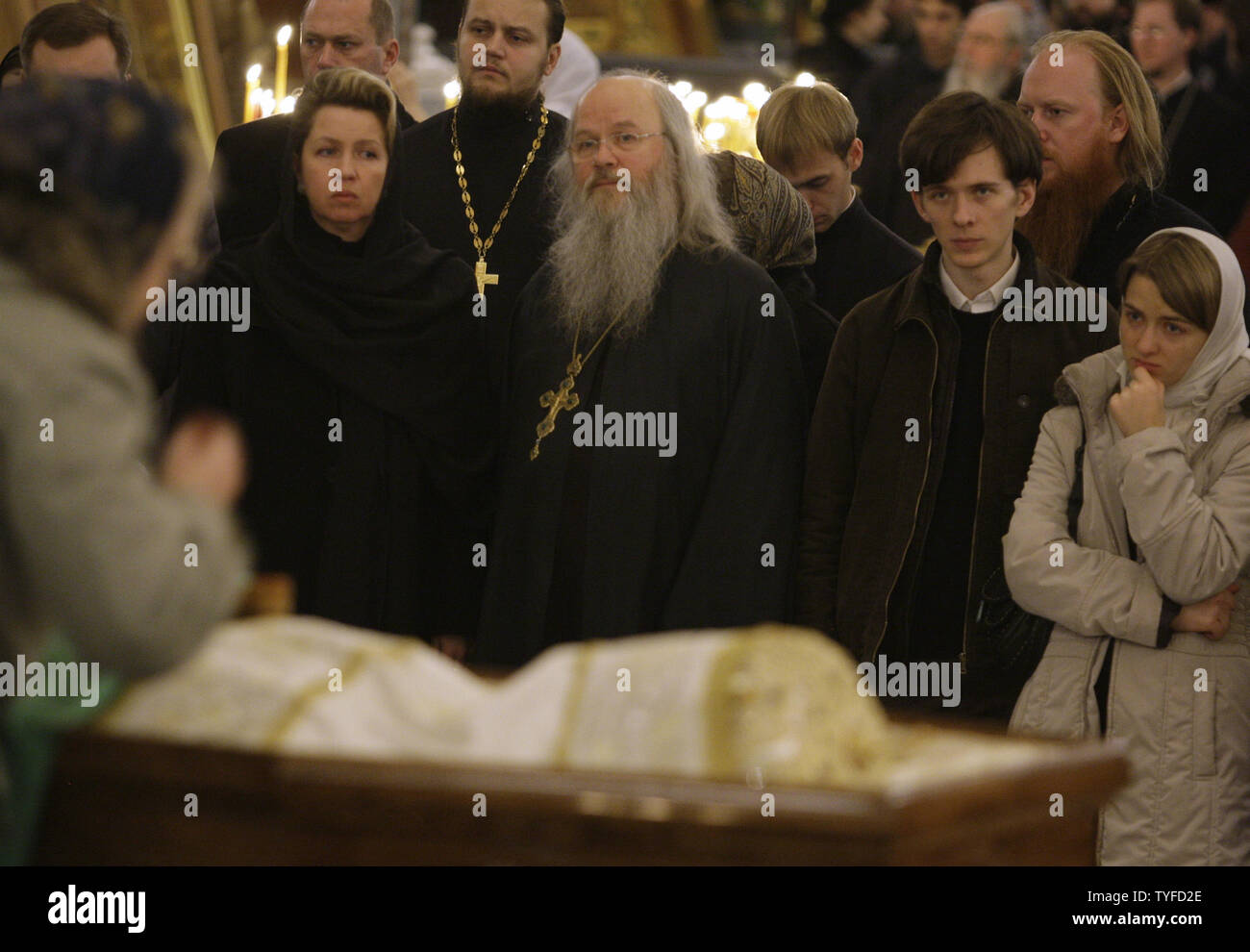 Russian first lady Svetlana Medvedeva (L) mourns at a casket with late Patriarch Alexy II in the Christ the Savior Cathedral in Moscow on December 7, 2008. Patriarch Alexy II who led the Russian Orthodox church since 1990 during a post-Soviet revival of faith, died at the age of 79 on Friday. (UPI Photo/Anatoli Zhdanov) Stock Photo