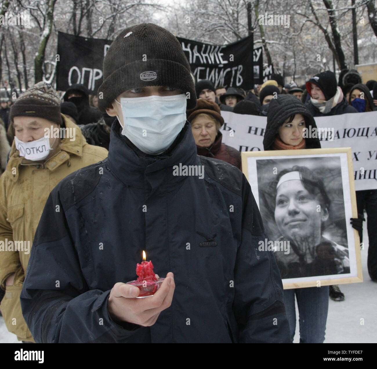 An opposition demonstrator holds a portrait of journalist Anastasia Baburova during a rally in Moscow on  February 15, 2009. Markelov and Baburova were shot dead on a Moscow street last month. (UPI Photo/Anatoli Zhdanov) Stock Photo