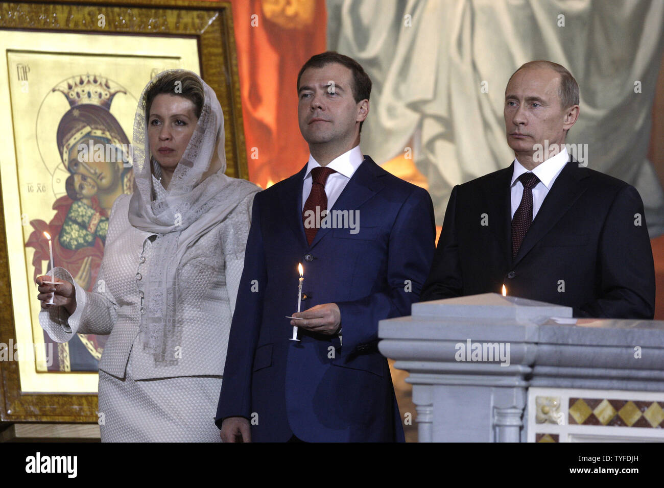 Russian President Dmitry Medvedev C With His Wife Svetlana And Prime Minister Vladimir Putin Stand During
