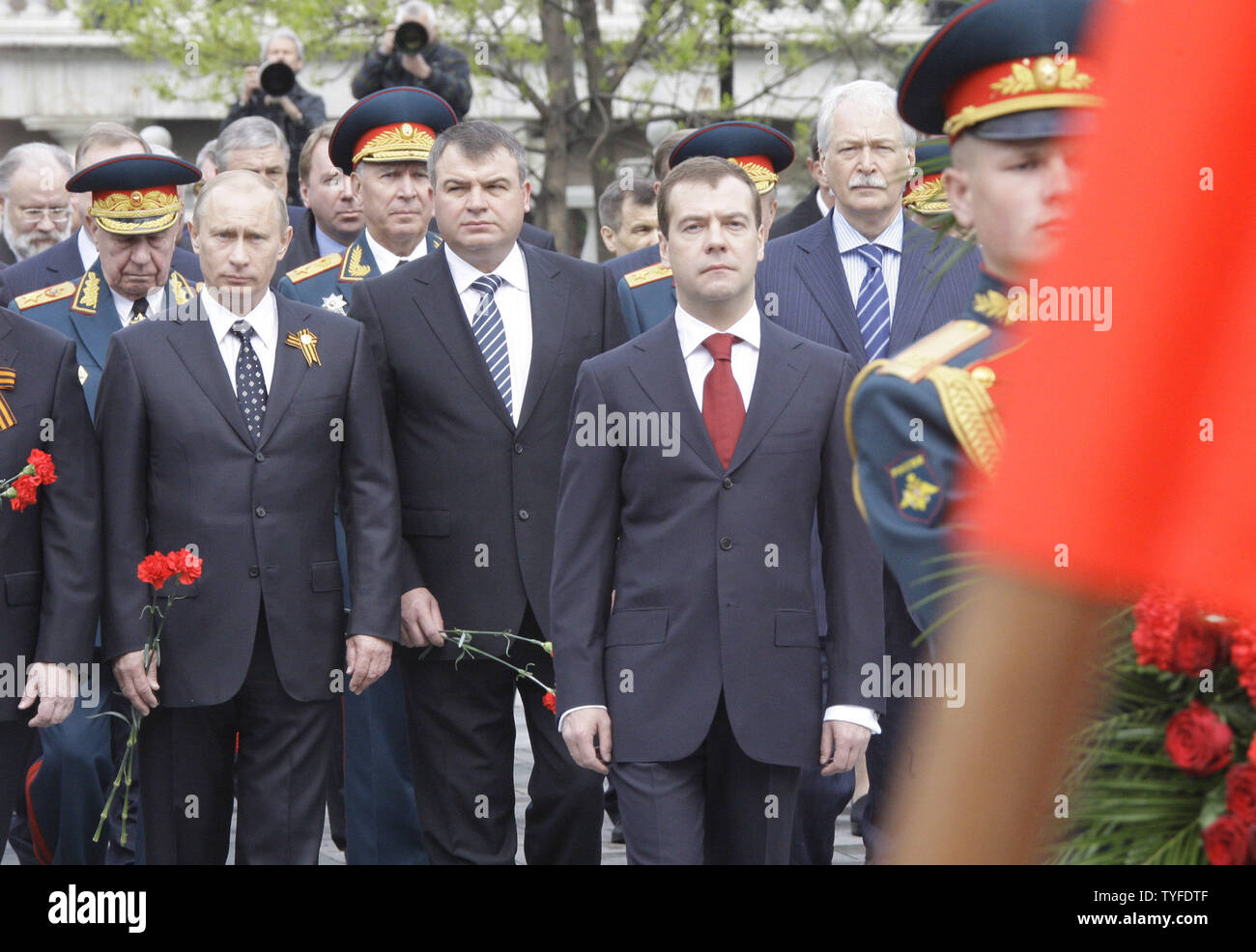 (L-R) Russian Prime Minister Vladimir Putin, Defence Minister Anatoly Serdyukov and President Dmitry Medvedev attend a wreath laying ceremony at the Tomb of the Unknown Soldier in Moscow on May 8, 2009 on the eve of the Victory Day. On May 9 Russia will celebrate the 64th anniversary of the World War II victory over Nazi Germany. (UPI Photo/Anatoli Zhdanov) Stock Photo
