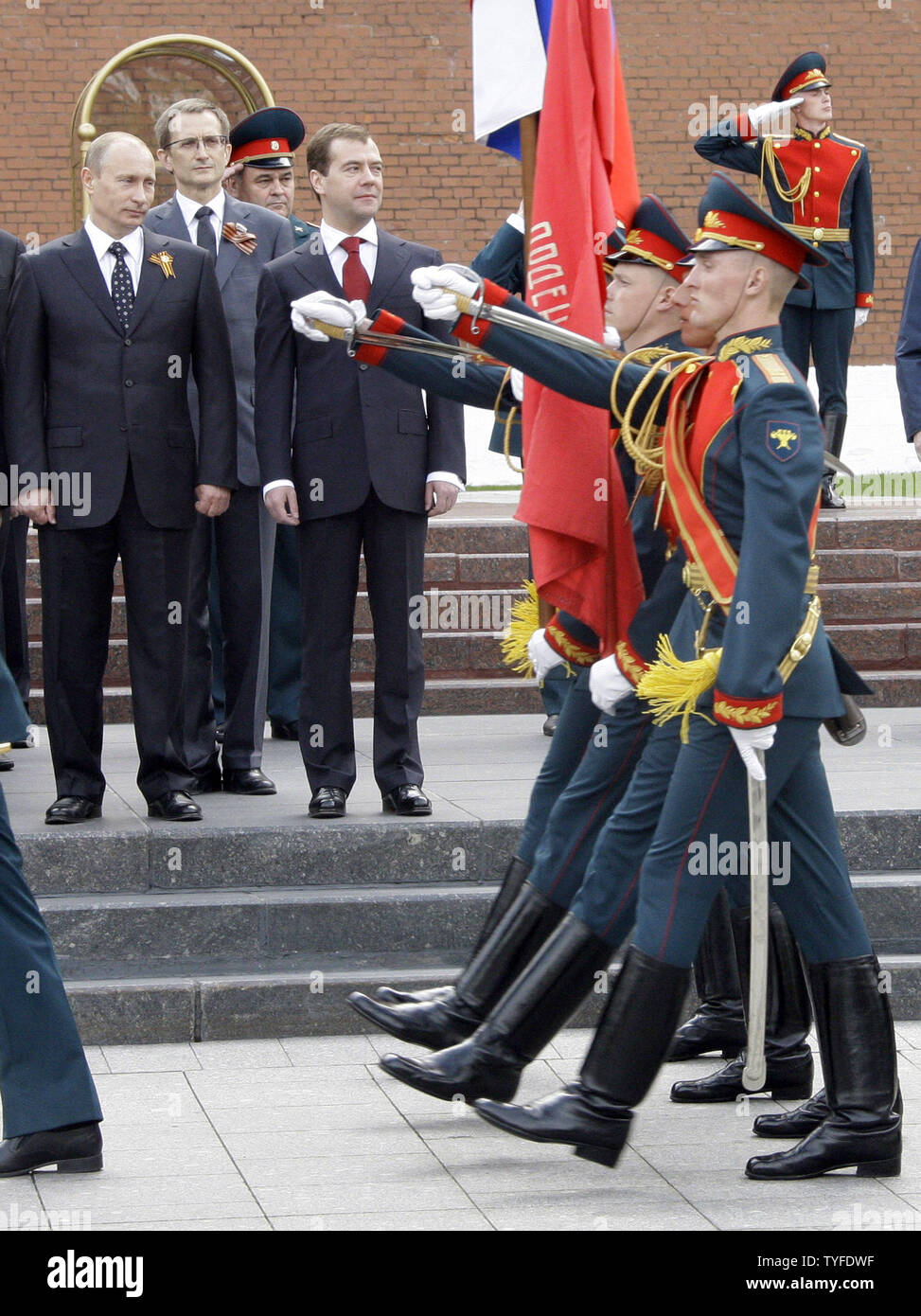 Russian President Dmitry Medvedev and Prime Minister Vladimir Putin (L) review the troops during a wreath laying ceremony at the Tomb of the Unknown Soldier in Moscow on May 8, 2009 on the eve of the Victory Day. On Saturday, May 9 Russia will celebrate the 64th anniversary of the World War Two victory over Nazi Germany. (UPI Photo/Anatoli Zhdanov) Stock Photo